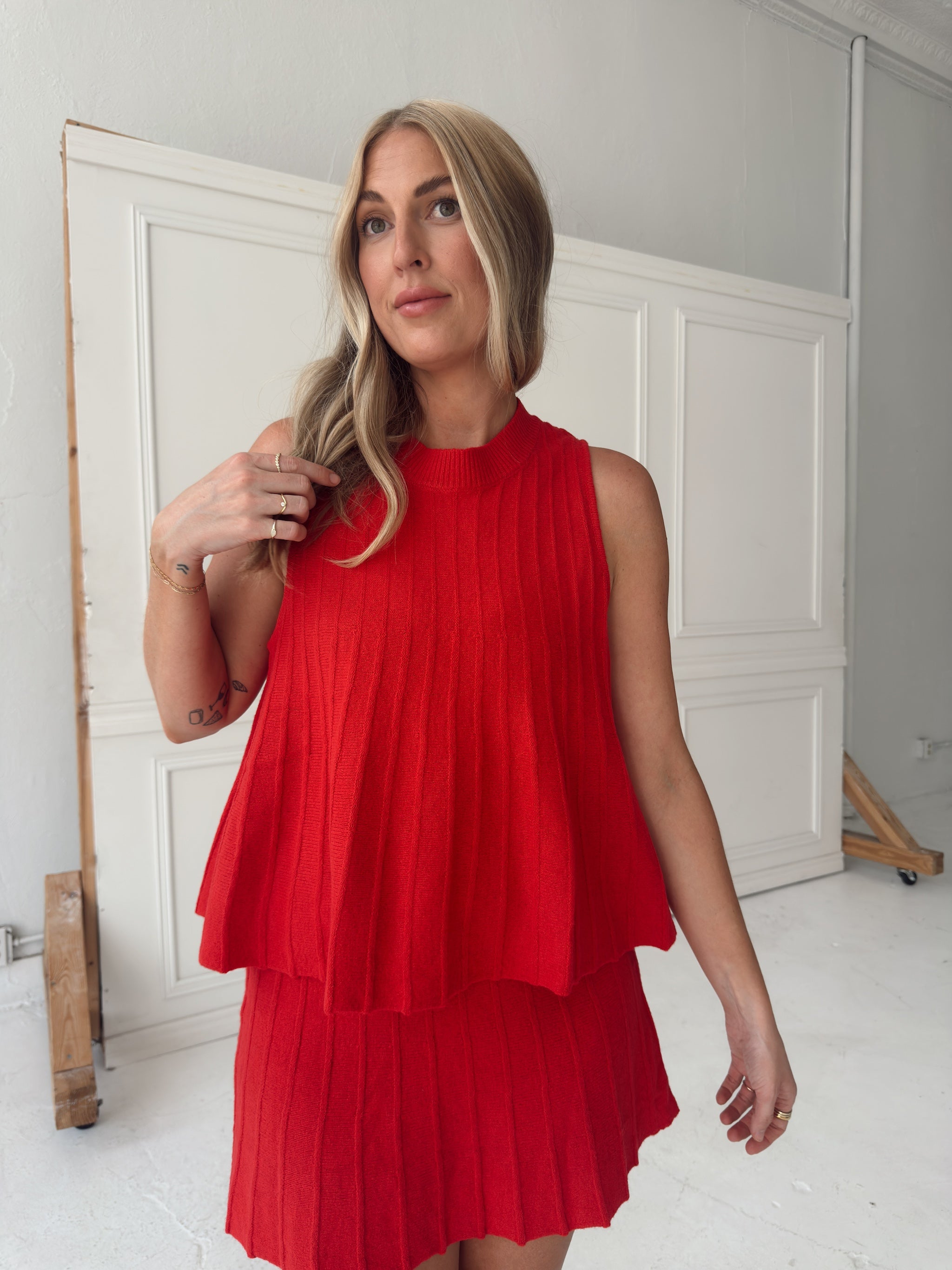 Rylan Ribbed Sweater Top With Flared Hem - Red